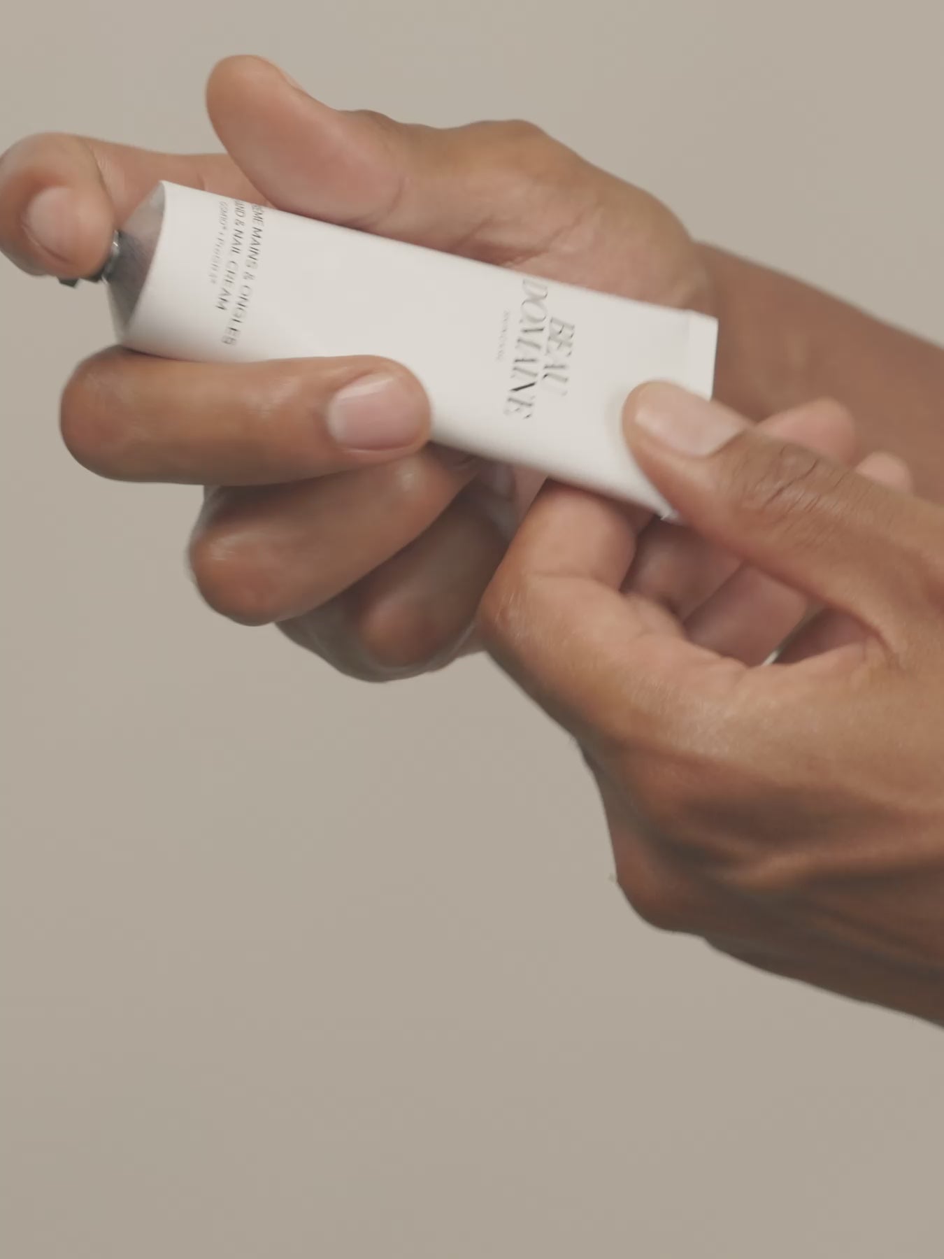 Video of a man applying The Hand & Nail Cream. 